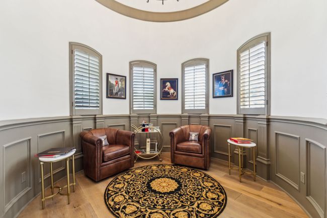 The Sitting Room Connected to the Office Showcases Beautiful Wood Paneled Walls | Image 16