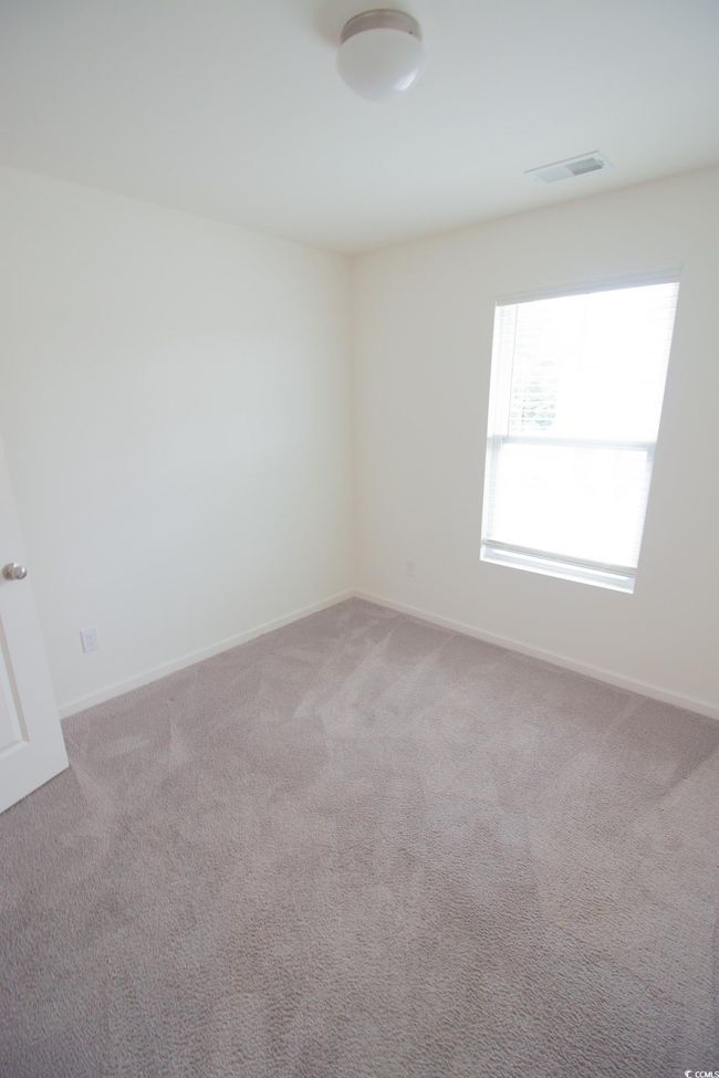 Carpeted empty room featuring baseboards | Image 20