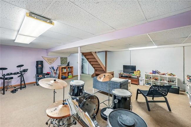 Versatile finished basement, perfect for recreation or hobbies. | Image 41