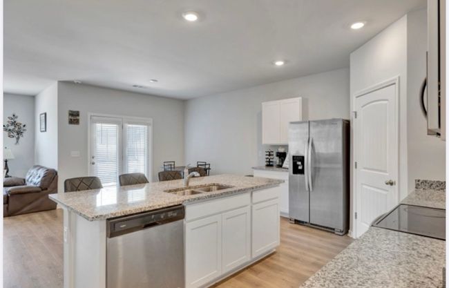French doors bring tons of natural light into dining area and opens up to covered patio. Great outside/ inside convenience. | Image 9