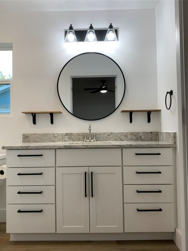 Bathroom featuring vanity, ceiling fan, and wood finished floors | Image 16