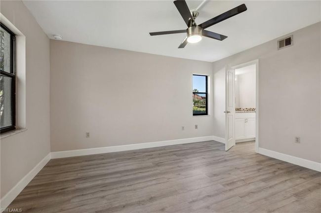 Spare room featuring light hardwood / wood-style flooring and ceiling fan | Image 4