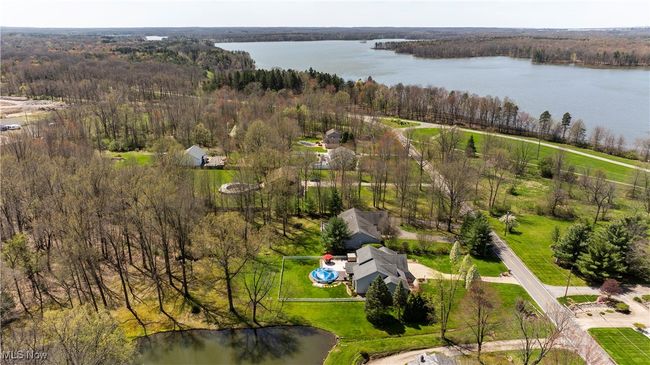 Bird's eye view featuring a wooded view and a water view | Image 46