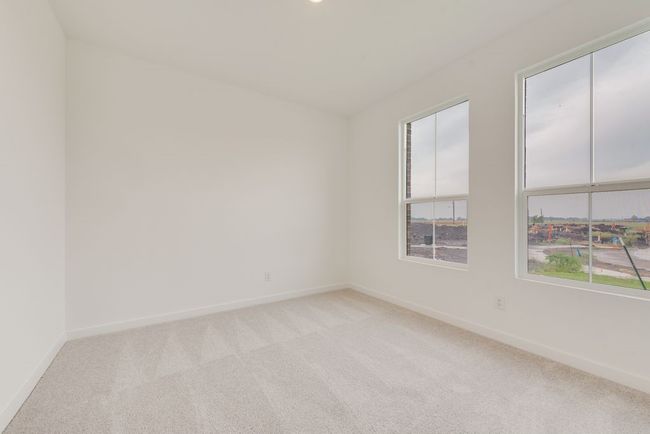 Empty room featuring light colored carpet, healthy amount of natural light, and baseboards | Image 12
