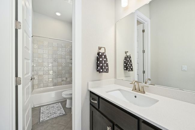 The guest bathrooms are beautifully designed with modern fixtures and finishes, ensuring a pleasant experience for all. | Image 19