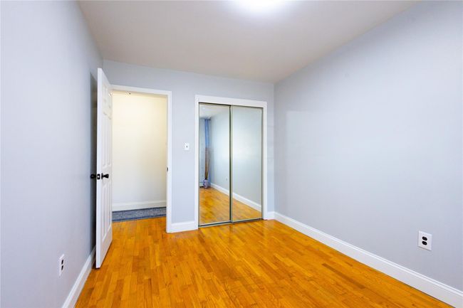 Unfurnished bedroom featuring light wood finished floors, baseboards, and a closet | Image 20