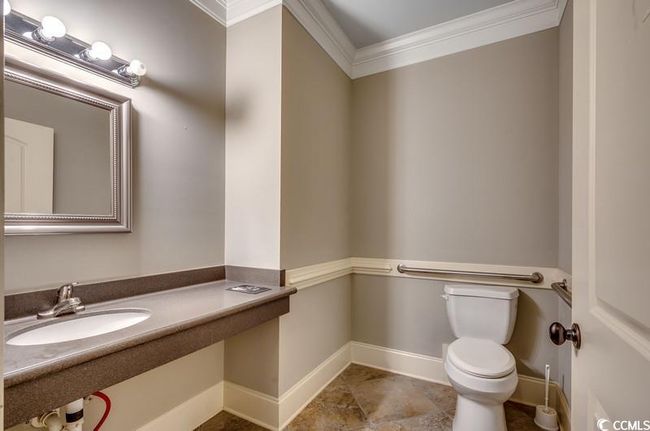Bathroom with crown molding, toilet, baseboards, and vanity | Image 16