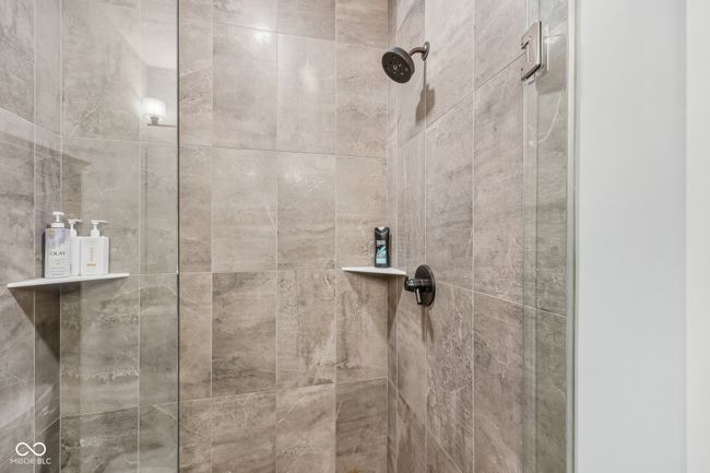 room details with a tile shower | Image 16