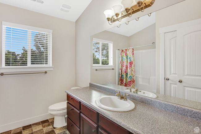 Full bath featuring vanity and a shower with curtain | Image 25