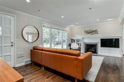 The first of two family spaces. This one offers a great fireplace with build-ins. | Image 3