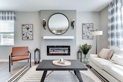 A sleek and elegant electric fireplace provides added ambiance to this living room. *Pictures of model home, colors may vary. | Image 1