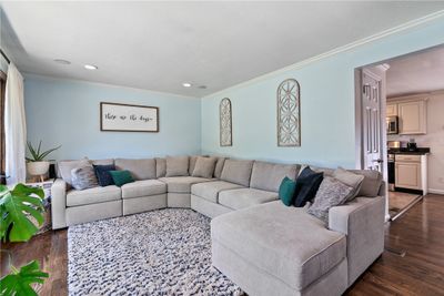 Gleaming refinished hardwood flooring in living and dining room and hallway. | Image 3