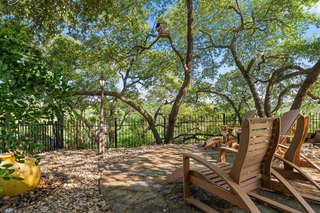 Imagine sitting around a firepit in the back corner of this wonderful yard overlooking the bluff and downtown Austin! | Image 36