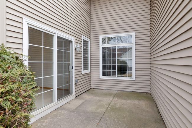 Sliding glass doors off the sunroom to a private patio | Image 37