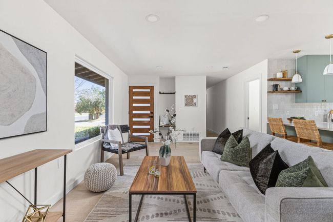Living area with recessed lighting and light wood-style flooring | Image 10