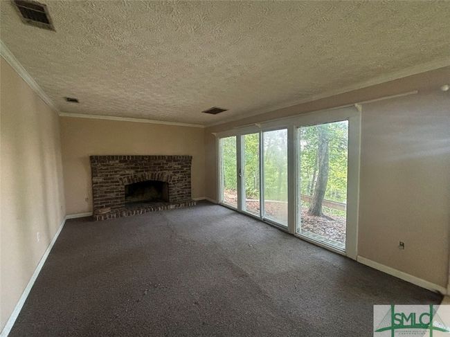 Den with fireplace | Image 18
