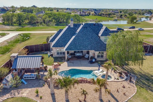 Aerial view of backyard, pool, and cabana. | Image 35