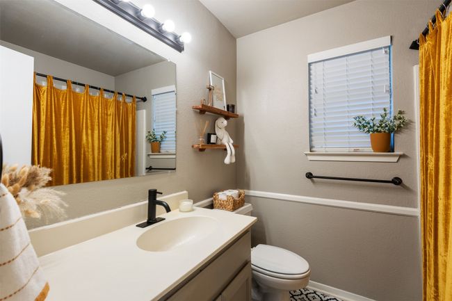 Bathroom featuring vanity and toilet | Image 12