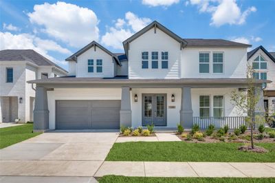 View of front of home with a garage and covered porch | Image 1