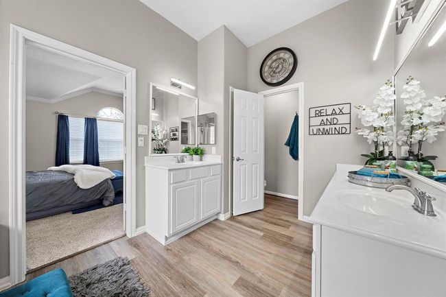Another view of primary bathroom leading into primary bedroom. | Image 23
