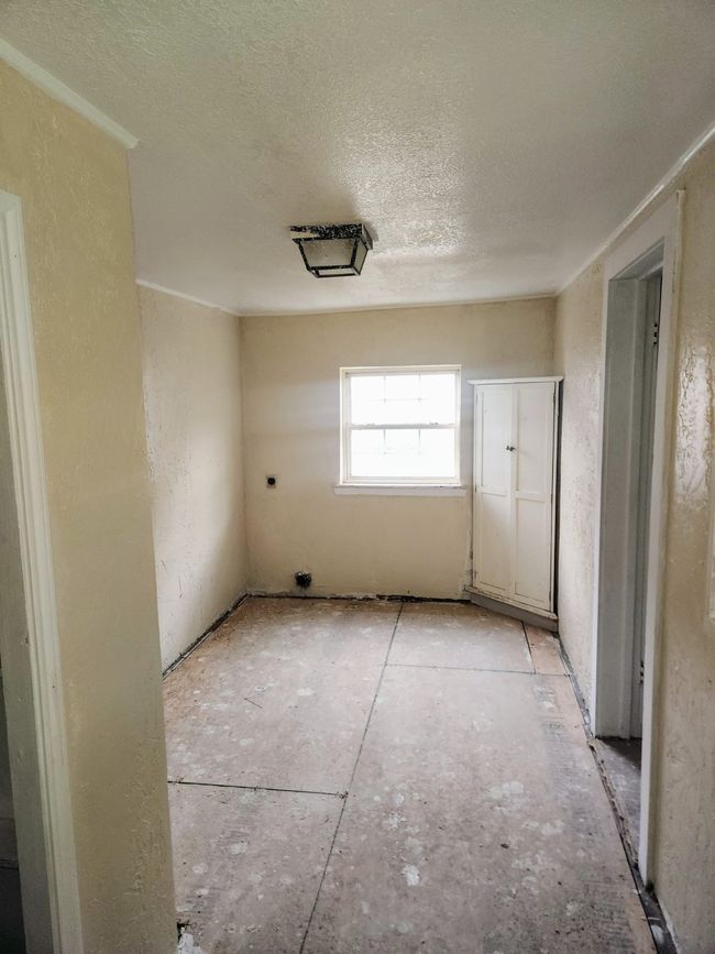 Spare room featuring a textured ceiling | Image 6