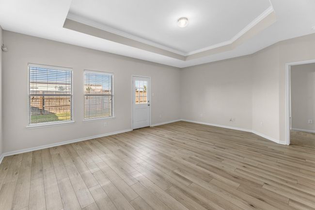 This home boasts a spacious family room that combines the best of modern design and comfort for everyday living. | Image 15
