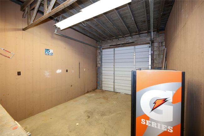 Garage featuring wood walls | Image 26