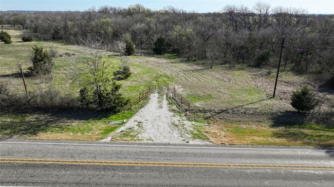 Pipe fence gated entrance and highway frontage | Image 6