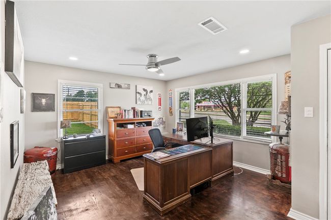 Home office with dark wood-style floors, a ceiling fan, and recessed lighting | Image 5