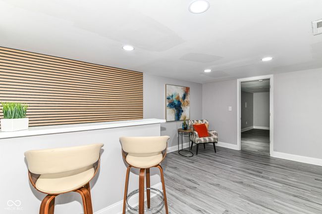 sitting room with recessed lighting, baseboards, and wood finished floors | Image 26