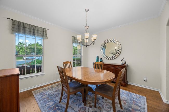 The dining room is located at the front of the home and is connected to the kitchen. | Image 9