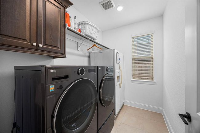 Laundry room with plenty of storage and space for refrigerator or deep freezer. | Image 15