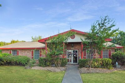 View of front of home with a front lawn | Image 1