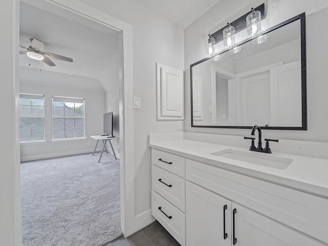 Bathroom featuring vanity, baseboards, and ceiling fan | Image 26