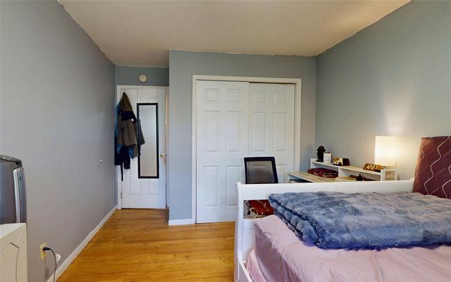 Bedroom featuring light wood-style flooring, a closet, and baseboards | Image 36