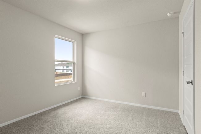Carpeted spare room featuring baseboards | Image 32