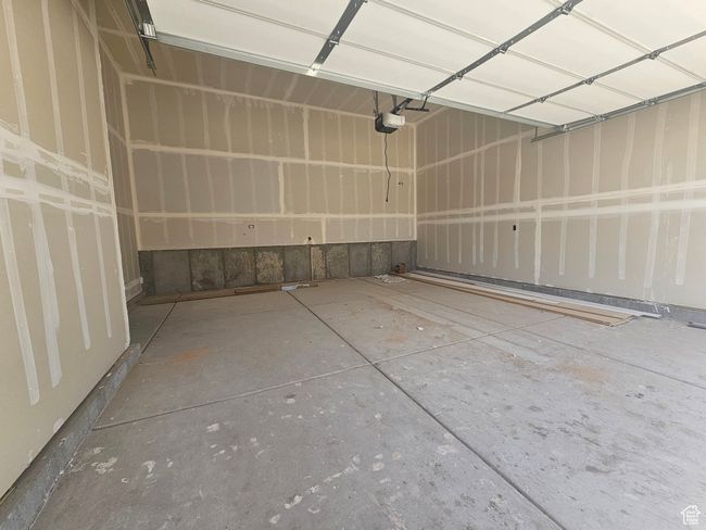 Garage with a garage door opener | Image 6