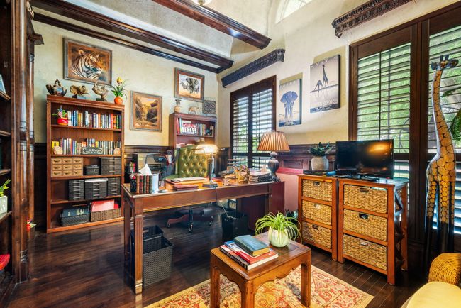 Home office with healthy amount of natural light and wood finished floors | Image 15
