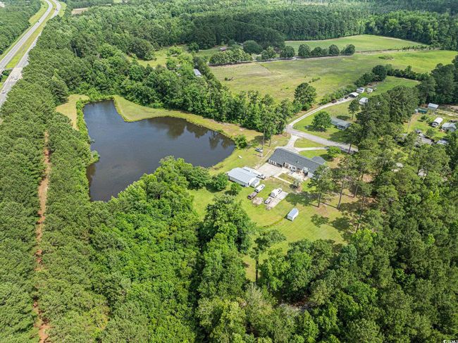 Aerial overview of property's location with a nearby body of​​‌​​​​‌​​‌‌​‌‌​​​‌‌​​‌‌​‌​​​​​‌ water | Image 35