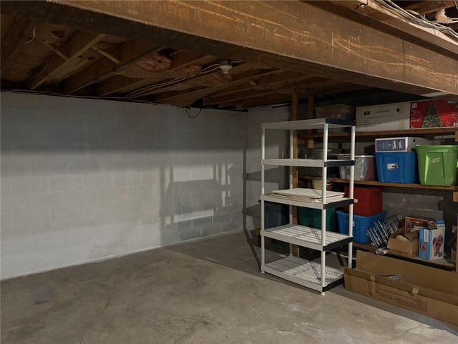 Unfinished below grade area with concrete block wall | Image 17