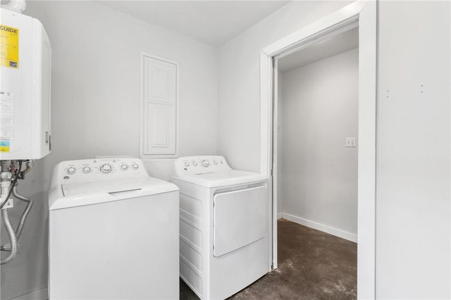 Washroom with water heater and washing machine and dryer | Image 33