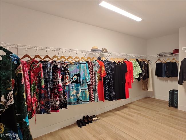 Walk in closet with wood finished floors | Image 38