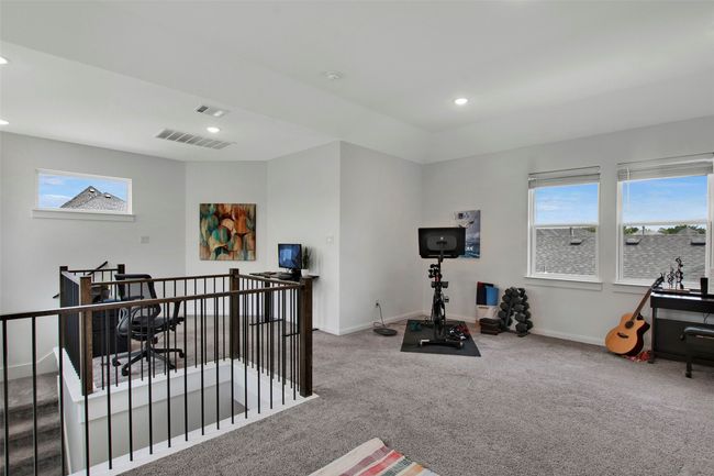 Workout room featuring carpet, plenty of natural light, baseboards, and recessed lighting | Image 19