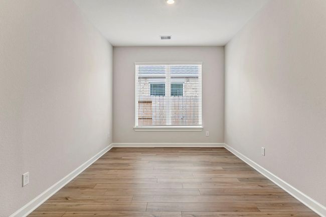 Located just adjacent to the living room, the dining room has lots of natural light and can accommodate even the largest of tables. | Image 7