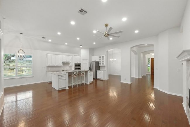 Open concept floor plan. kitchen offers eat-in bar with stroage on both sides of island. | Image 9