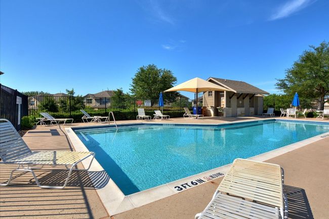 Community pool with a patio | Image 21