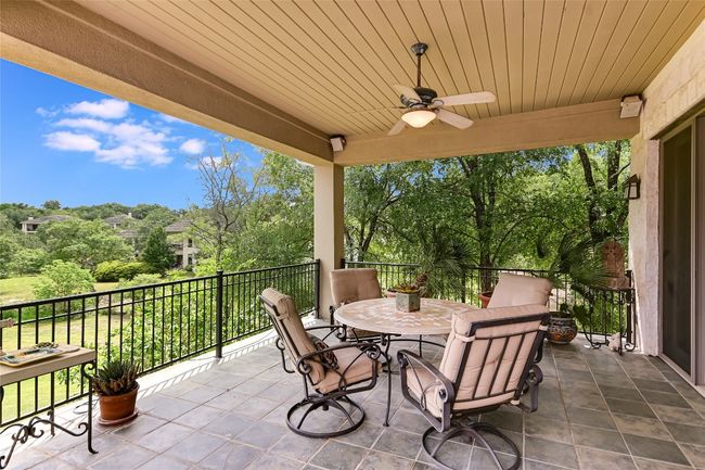 Back covered patio with scenic views of the 2nd hole of the Fazio golf course | Image 22