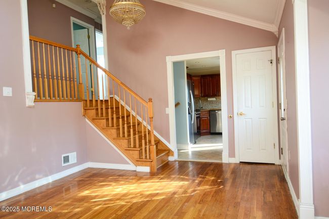 Gleaming Hard Wood Flooring in Great Room/Living Room. Oak Staircase. | Image 9
