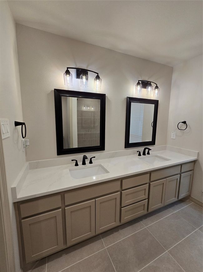 Full bathroom featuring double vanity and tile patterned floors | Image 11
