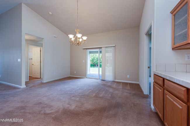 Dining room opens to patio via slider | Image 12